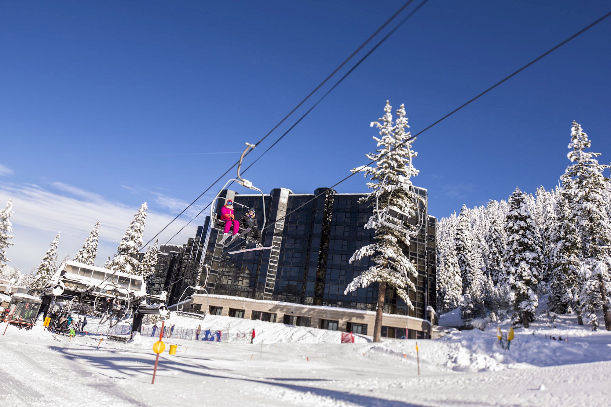 Ski-in access chairlift beside Everline residential tower