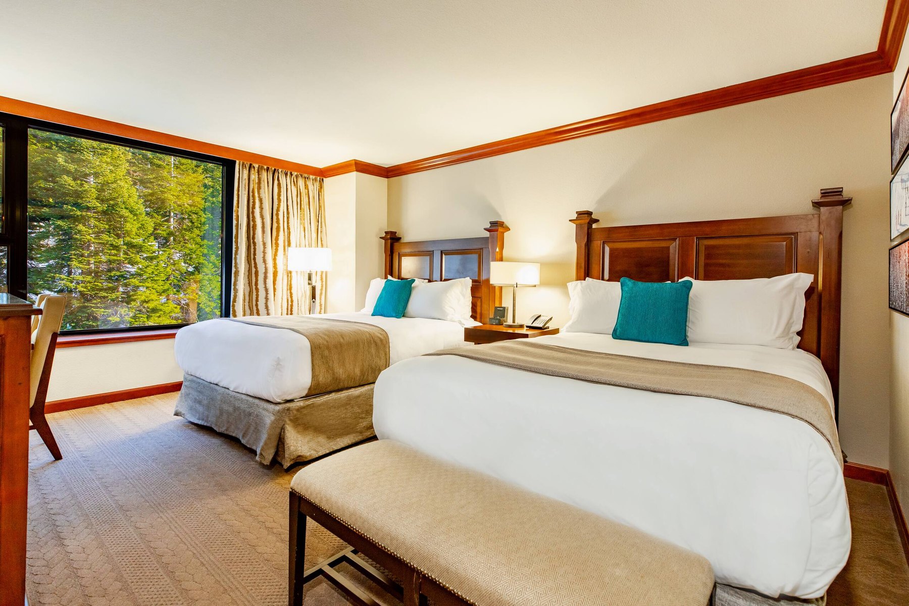 Representative Everline suite bedroom with forest views