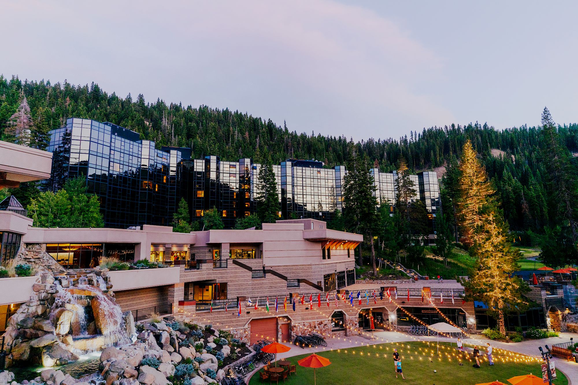 Everline Resort Midrise tower exterior at dusk with mountain backdrop