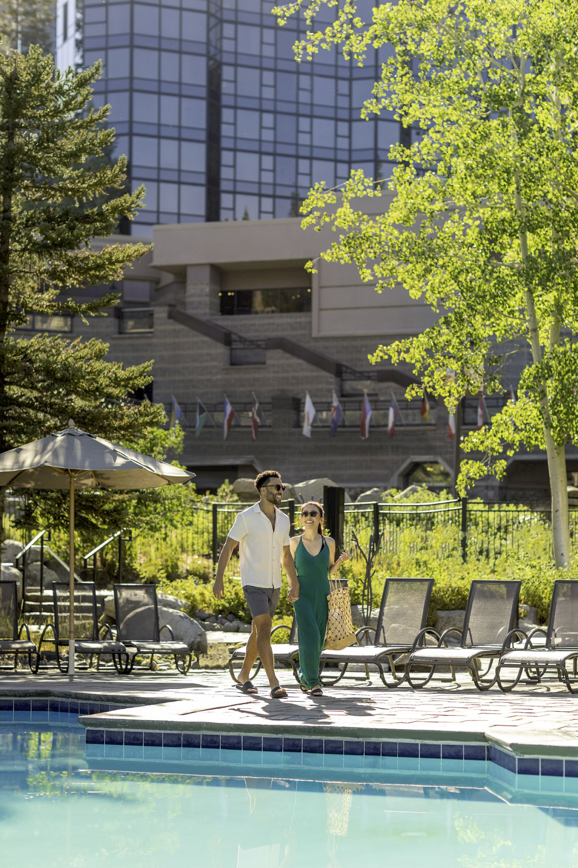 Pool deck with Everline Midrise glass tower beyond